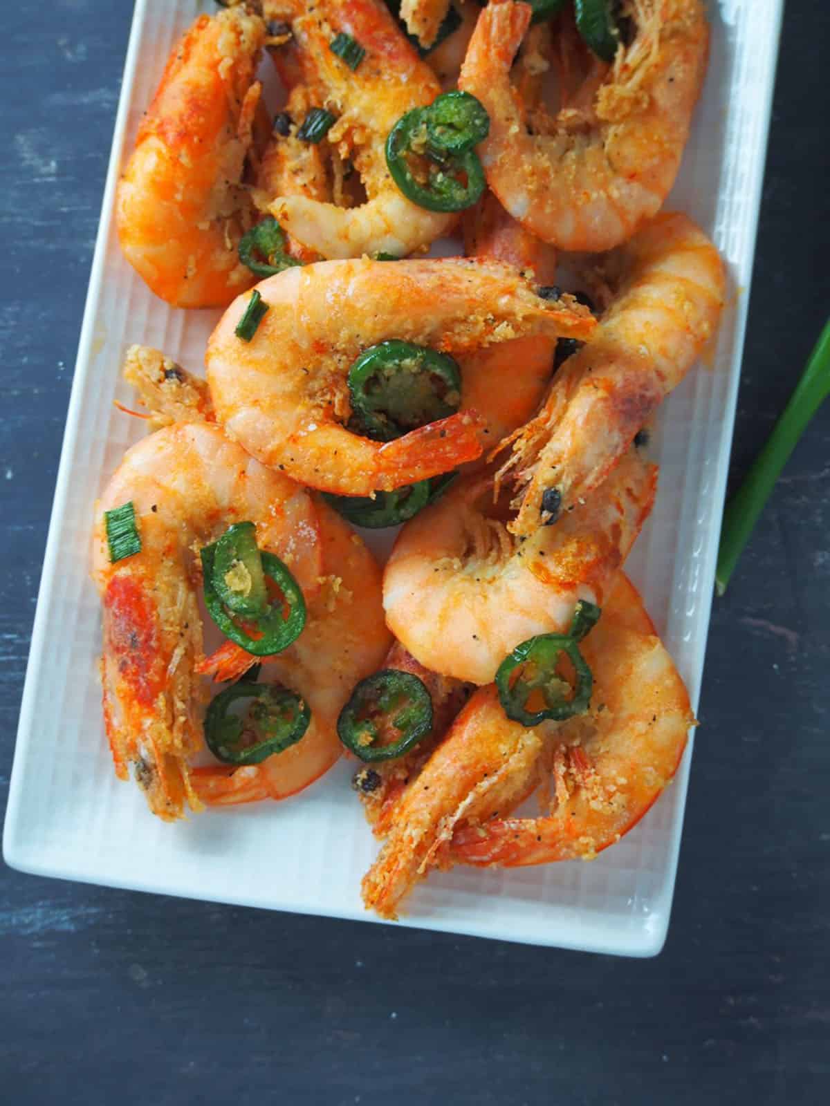 Salt and Pepper Shrimp on a white rectangular serving platter.