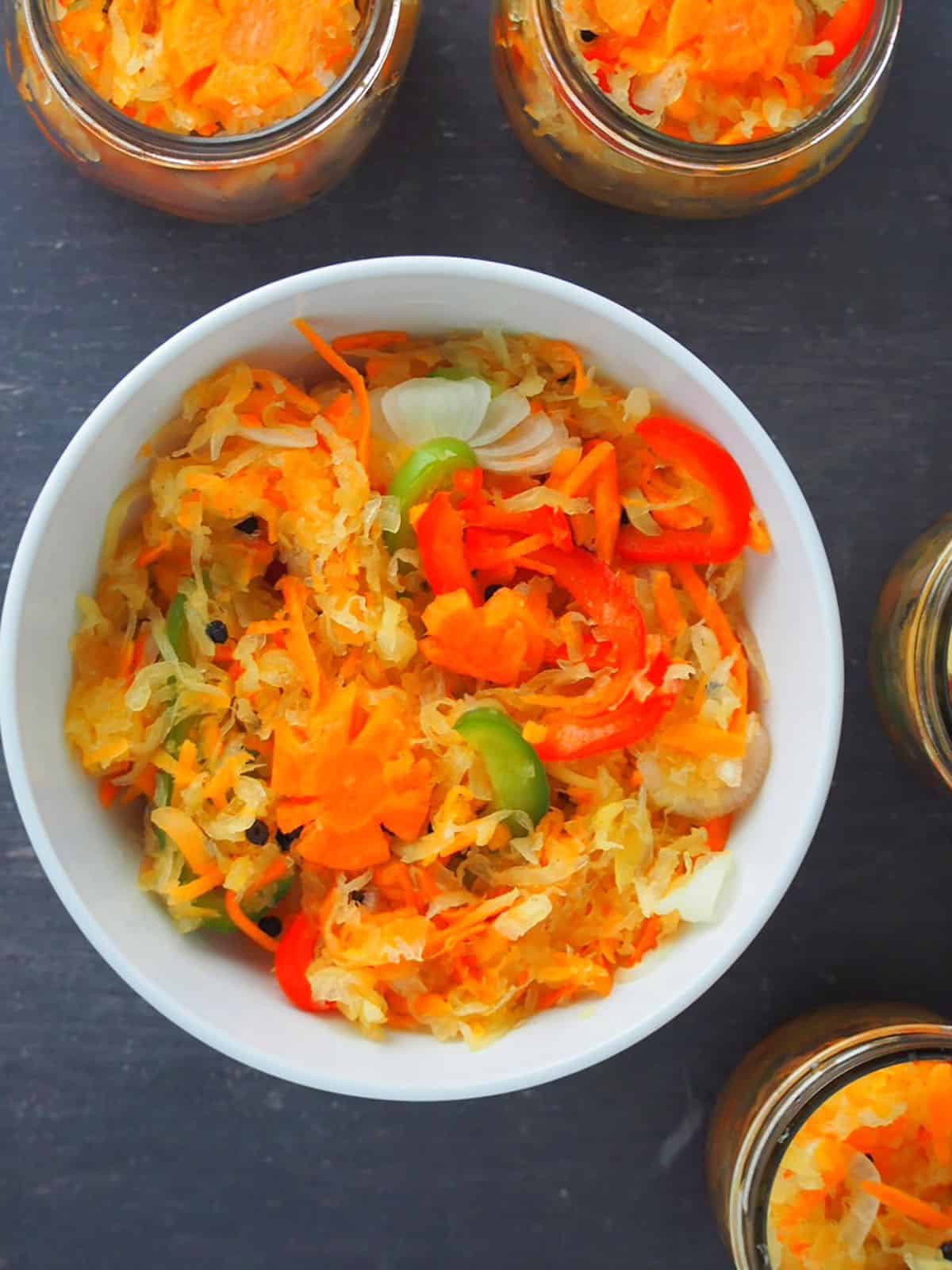 pickled papaya in a white bowl.