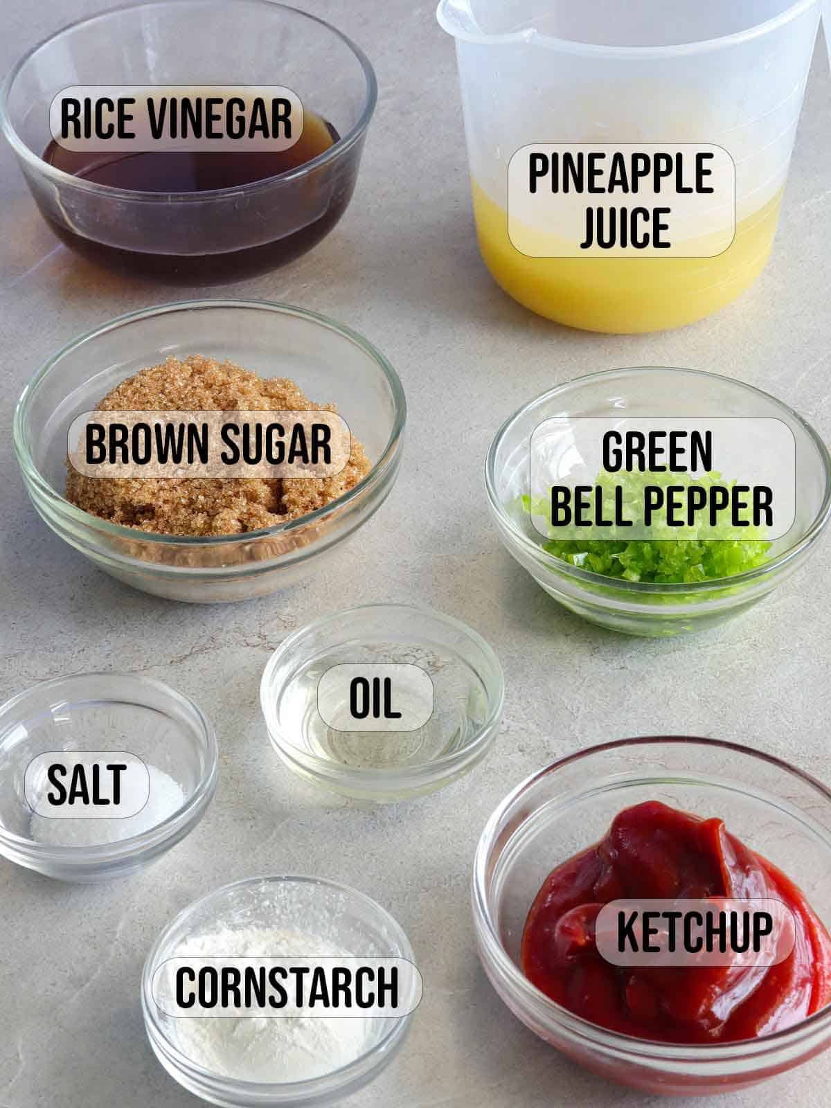 ketchup, pineapple juice, chopped bell peppers, brown sugar, salt, oil, rice vinegar, salt in bowls.