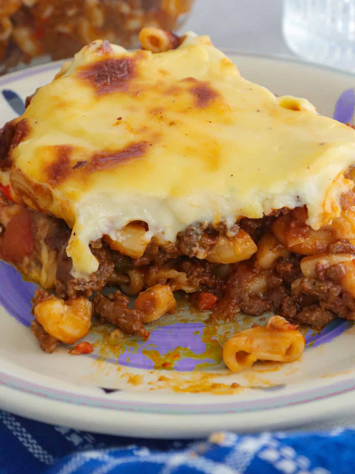 eating Filipino-style beef macaroni on a plate.