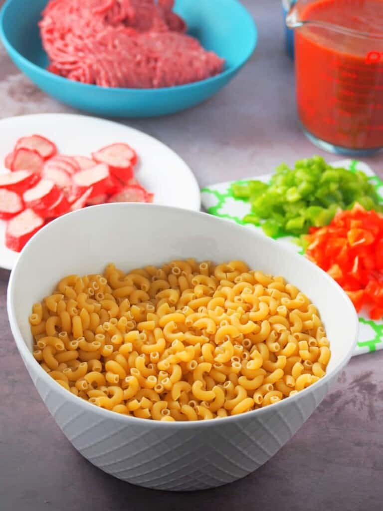 elbow macaroni, sliced hot dogs, ground beef, spaghetti sauce, diced bell peppers