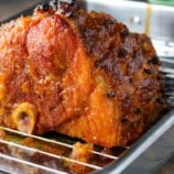 baked ham on a wire rack.