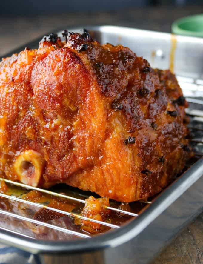 baked ham on a wire rack.