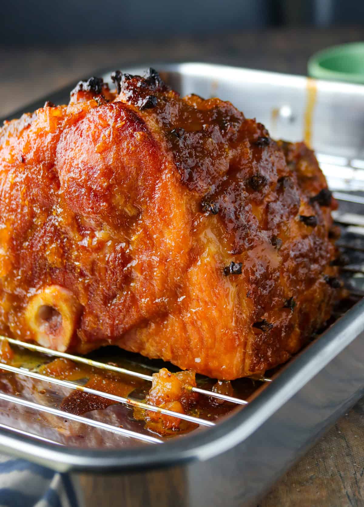 baked ham on a wire rack.