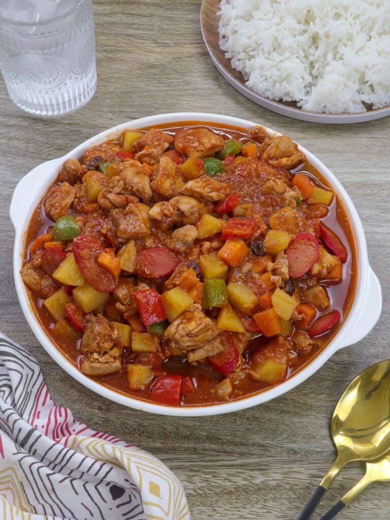 menudong manok in a white serving bowl.