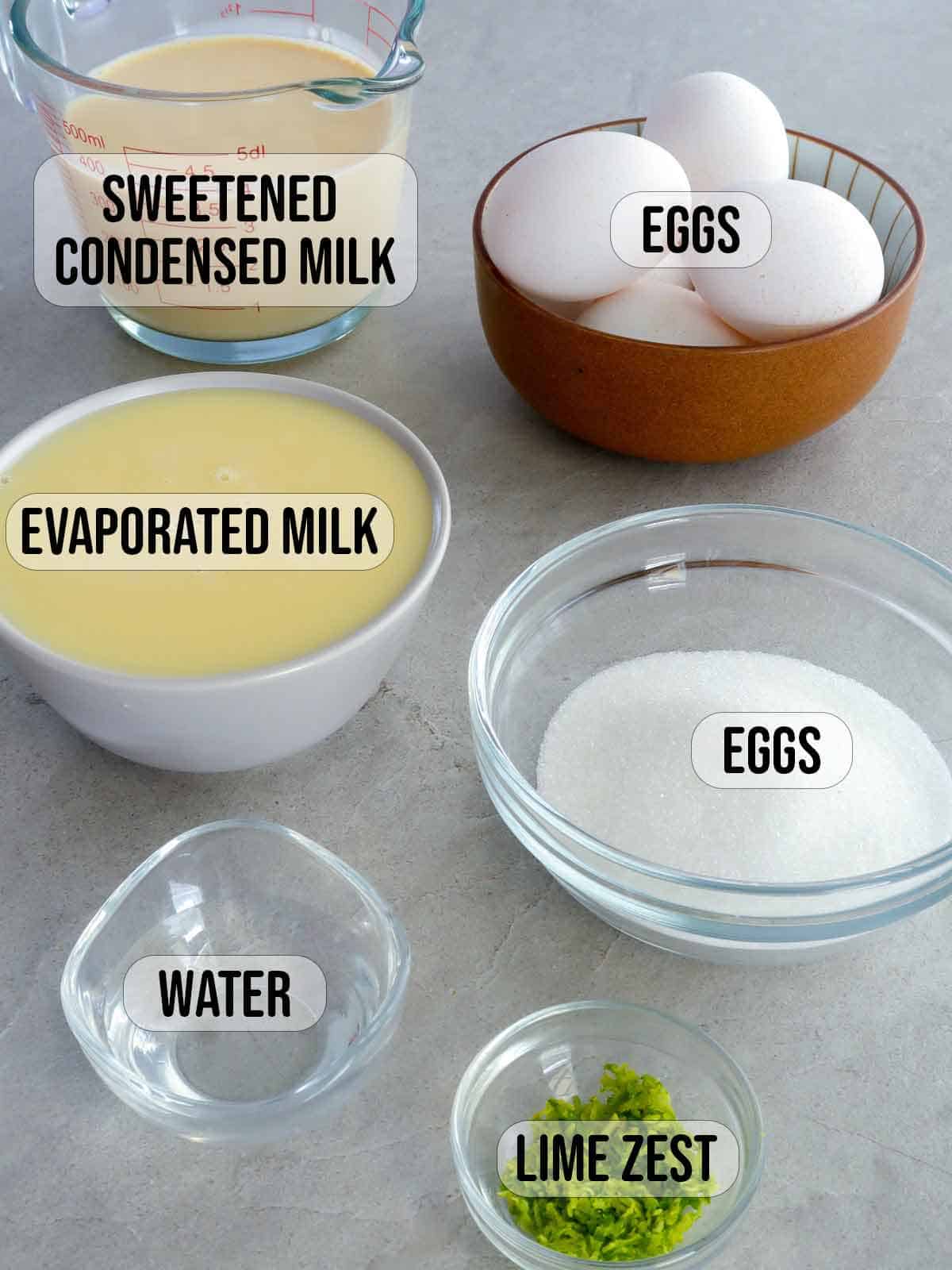 eggs, condensed milk, evaporated milk, sugar, water, lime zest in bowls.