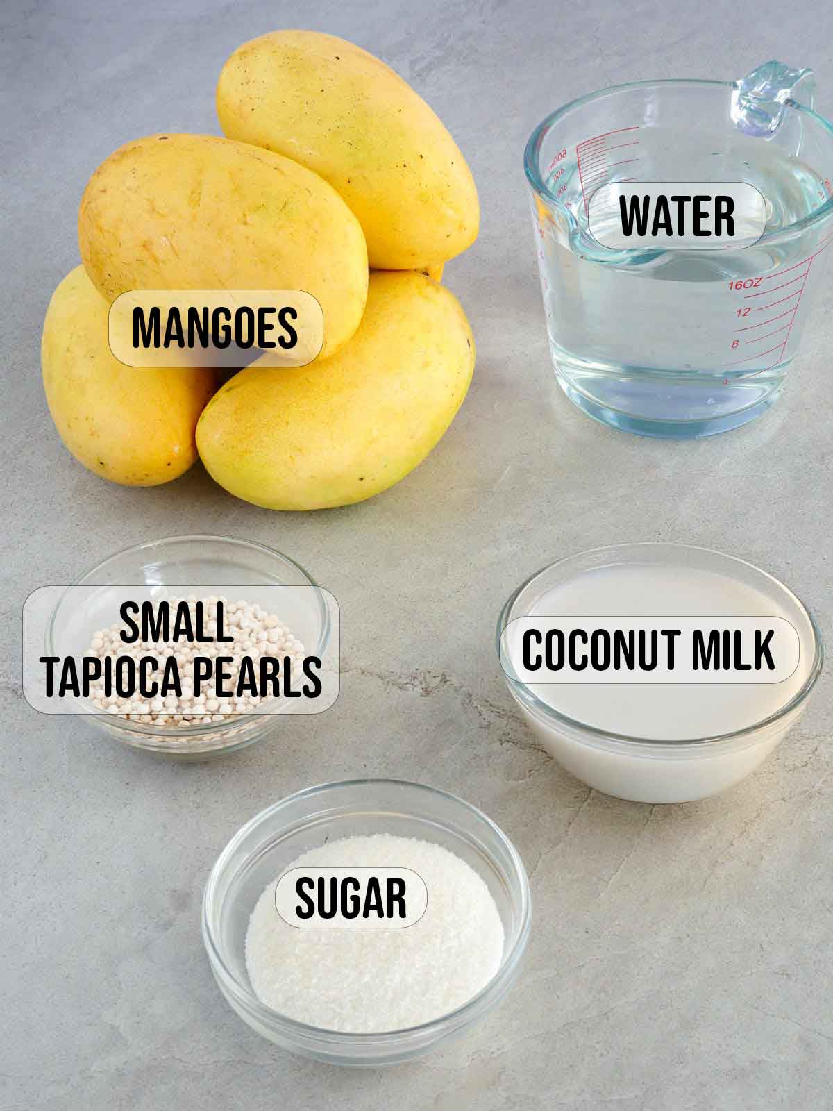 mangoes, tapioca pearls, sugar, coconut milk, water in bowls.