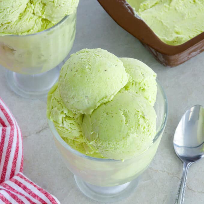 Avocado Ice Cream in a white serving glass.