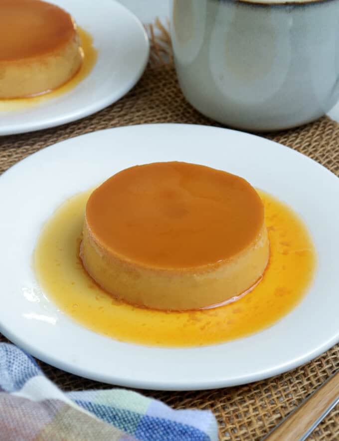 caramel flan on white plate.