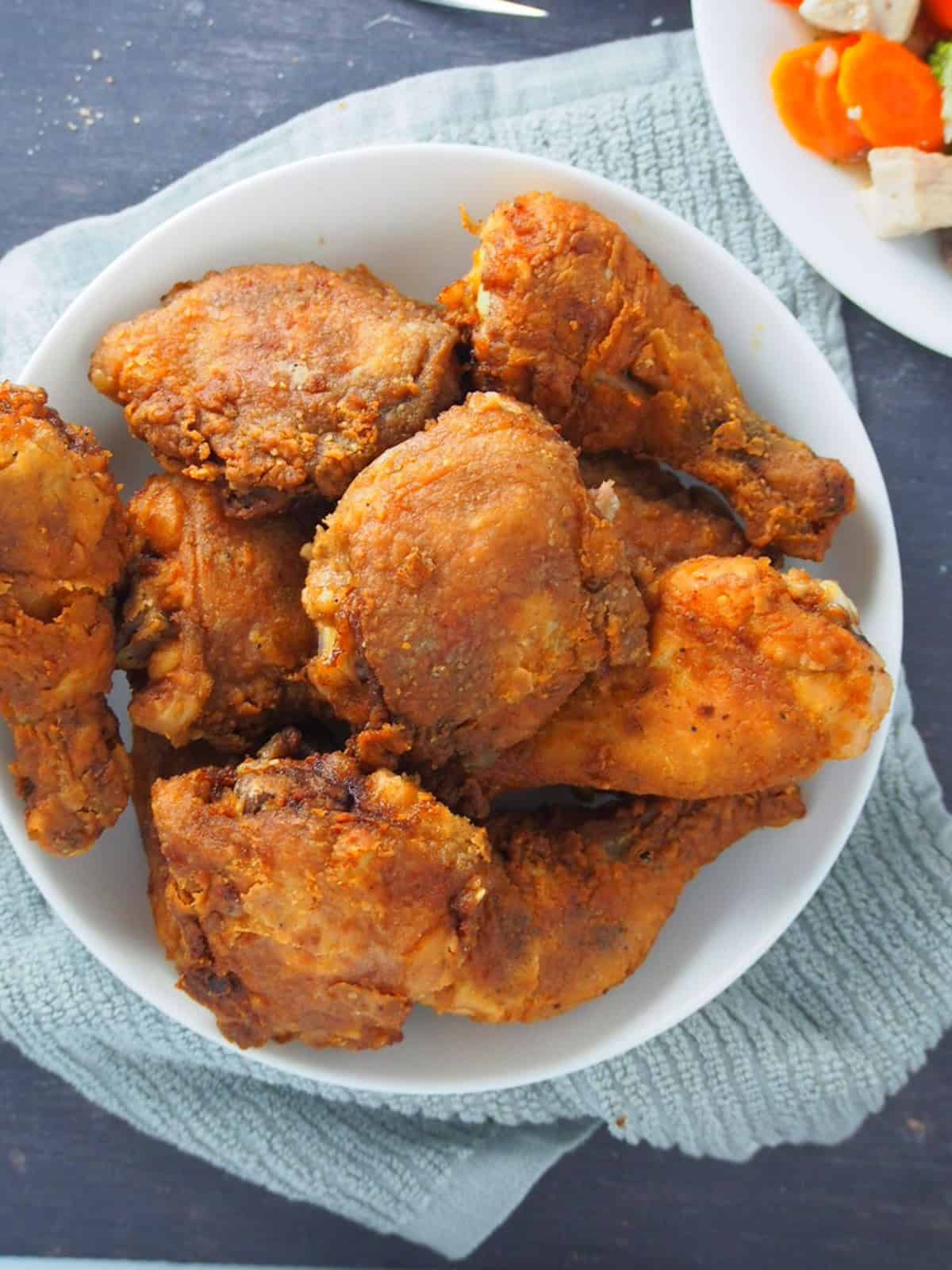 Crispy Fried Chicken on a white serving platter.