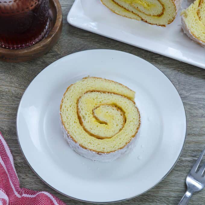 sliced Filipino jelly roll on a white plate.