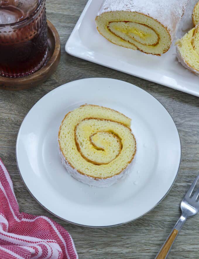 sliced Filipino jelly roll on a white plate.