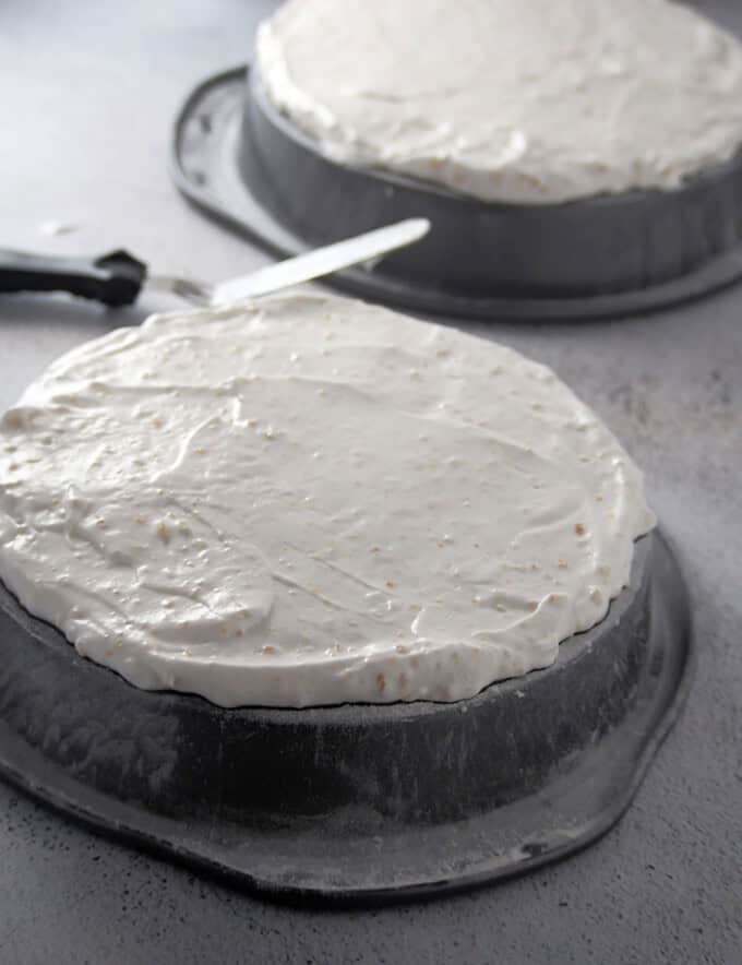 layer of meringue batter on inverted baking pan ready to bake.