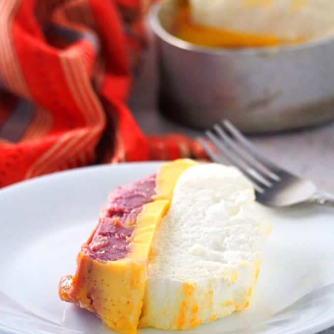 slice of 3-in-1 floating island dessert on a white serving plate.