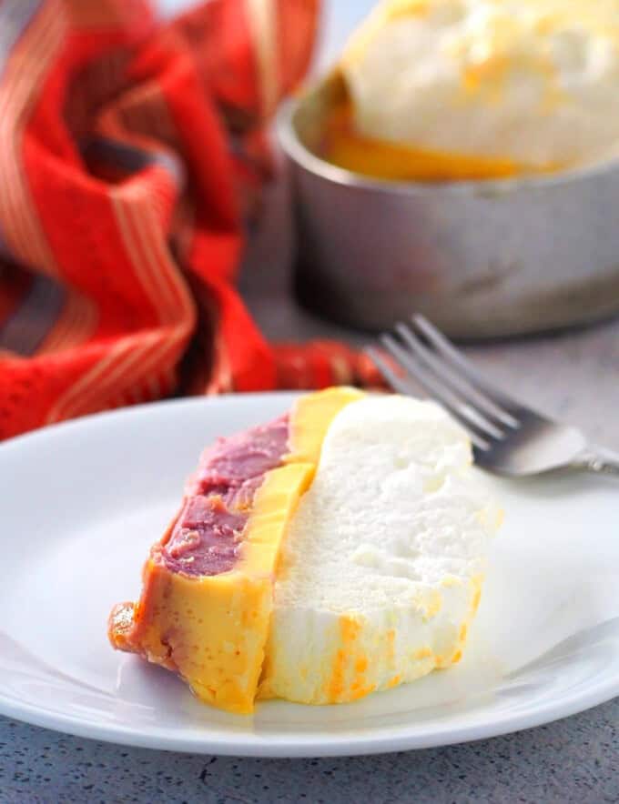 slice of 3-in-1 floating island dessert on a white serving plate.