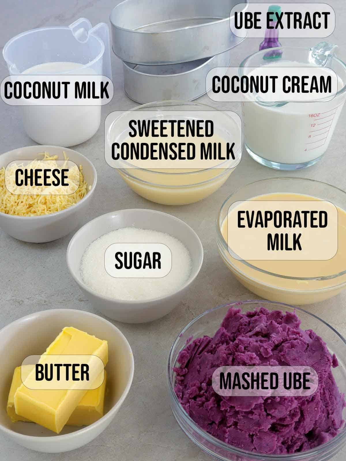 mashed ube, condensed milk, evaporated milk, butter, sugar, cheese, coconut milk in bowls.