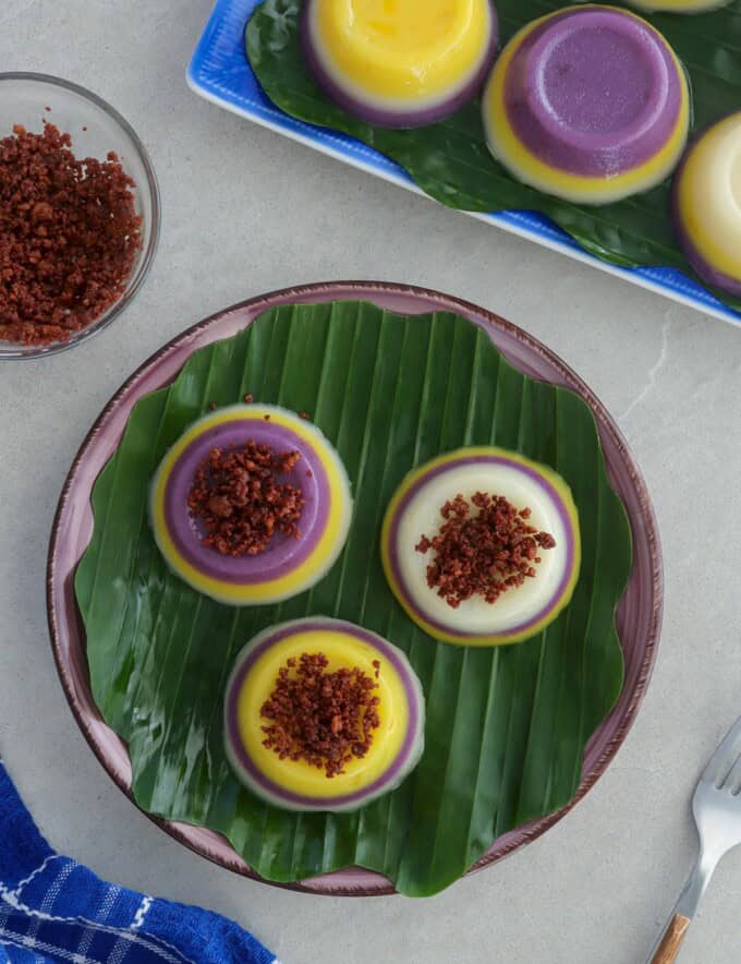 mini special sapin-sapin on a banana leaf-lined plate.