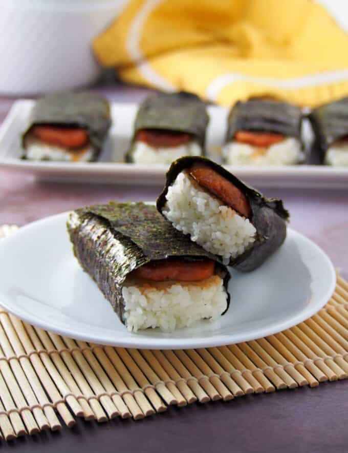 two spam musubi on a white serving plate