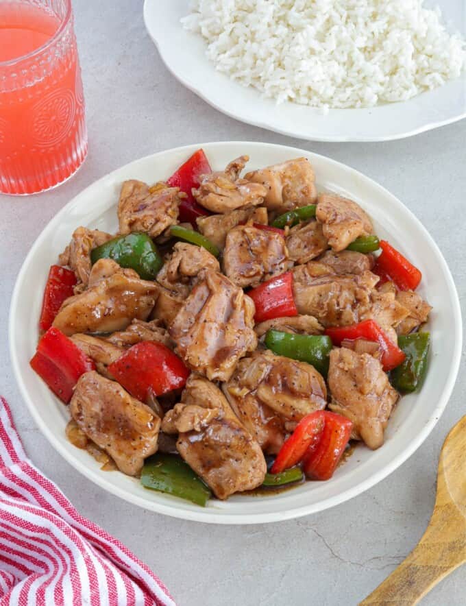 Chinese Black Pepper Chicken Stir-fry with bell peppers on a white serving platter.