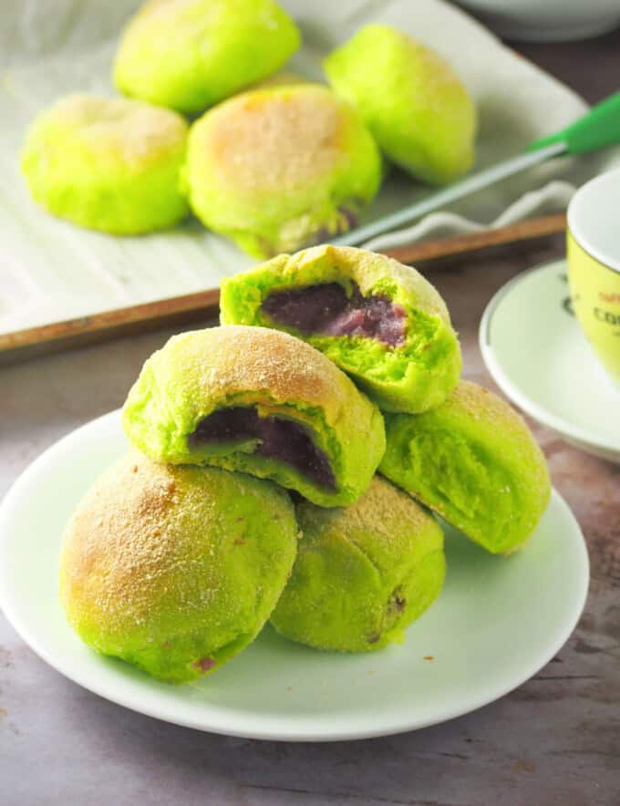 Pandan Pandesal with Ube Halaya Filling on a white plate.