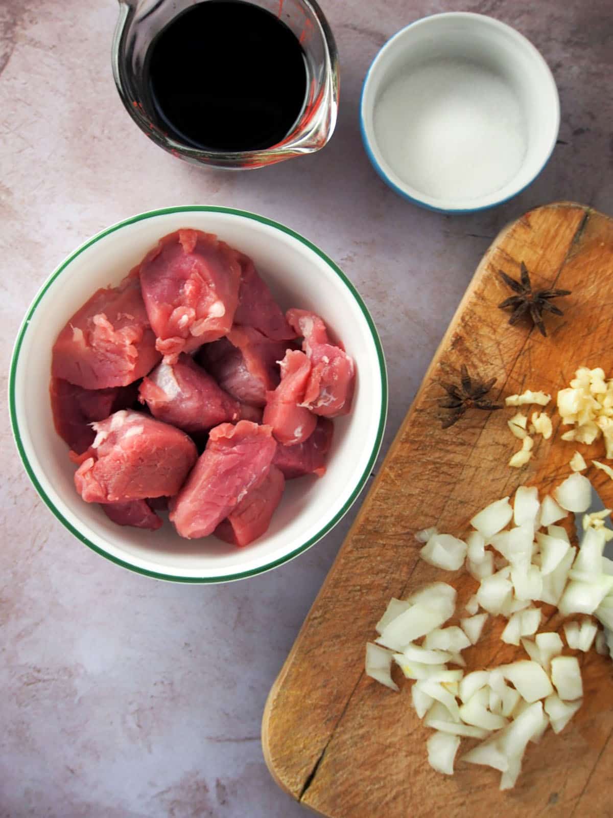 pork, soy sauce, sugar, star anise, garlic, onions.