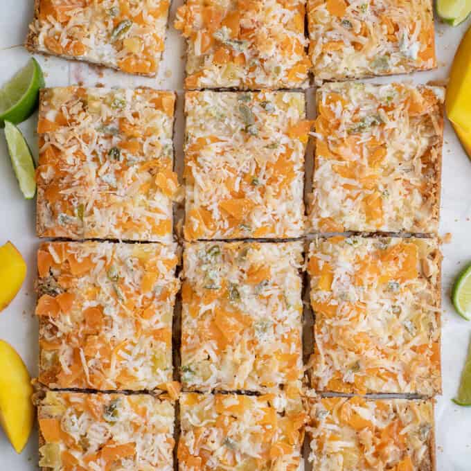 sliced magic cookie bars with tropical flavor.