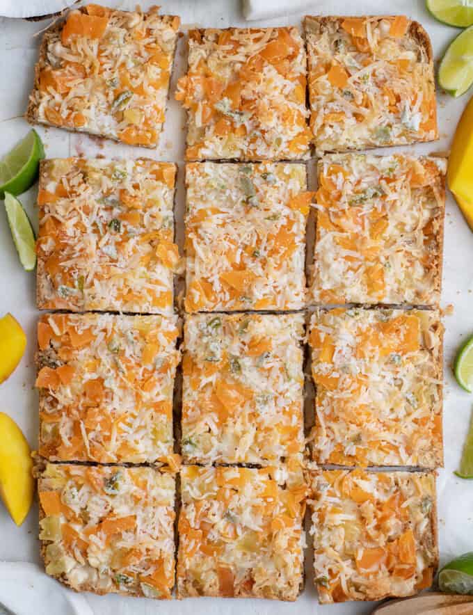 sliced magic cookie bars with tropical flavor.