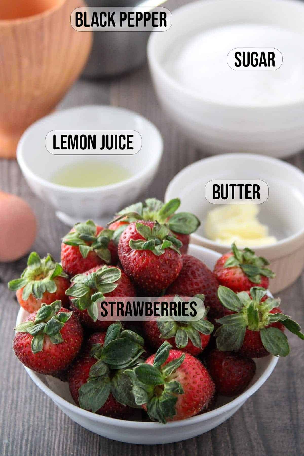 strawberries, sugar, lemon juice, and butter in individual bowls