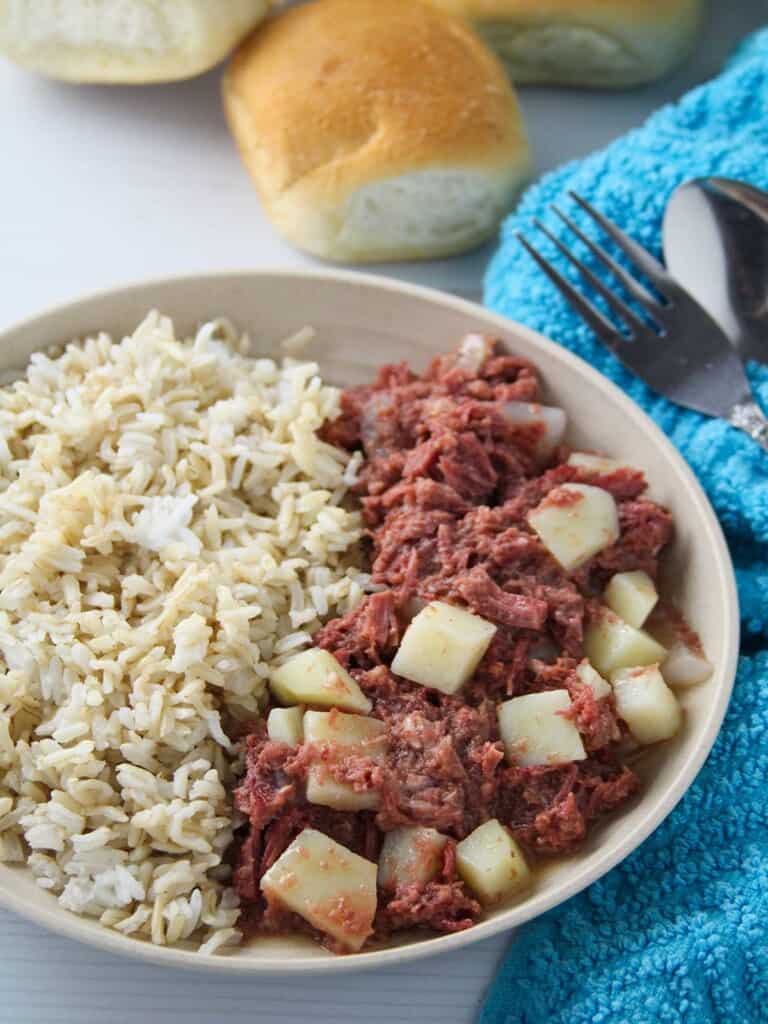 corned beef guisado with steamed rice on a serving plate