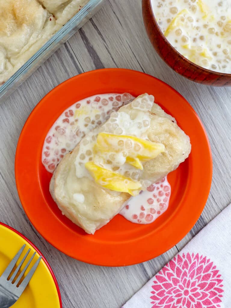 biibngkoy with ginataan sauce, sago, and langka on an orange plate.