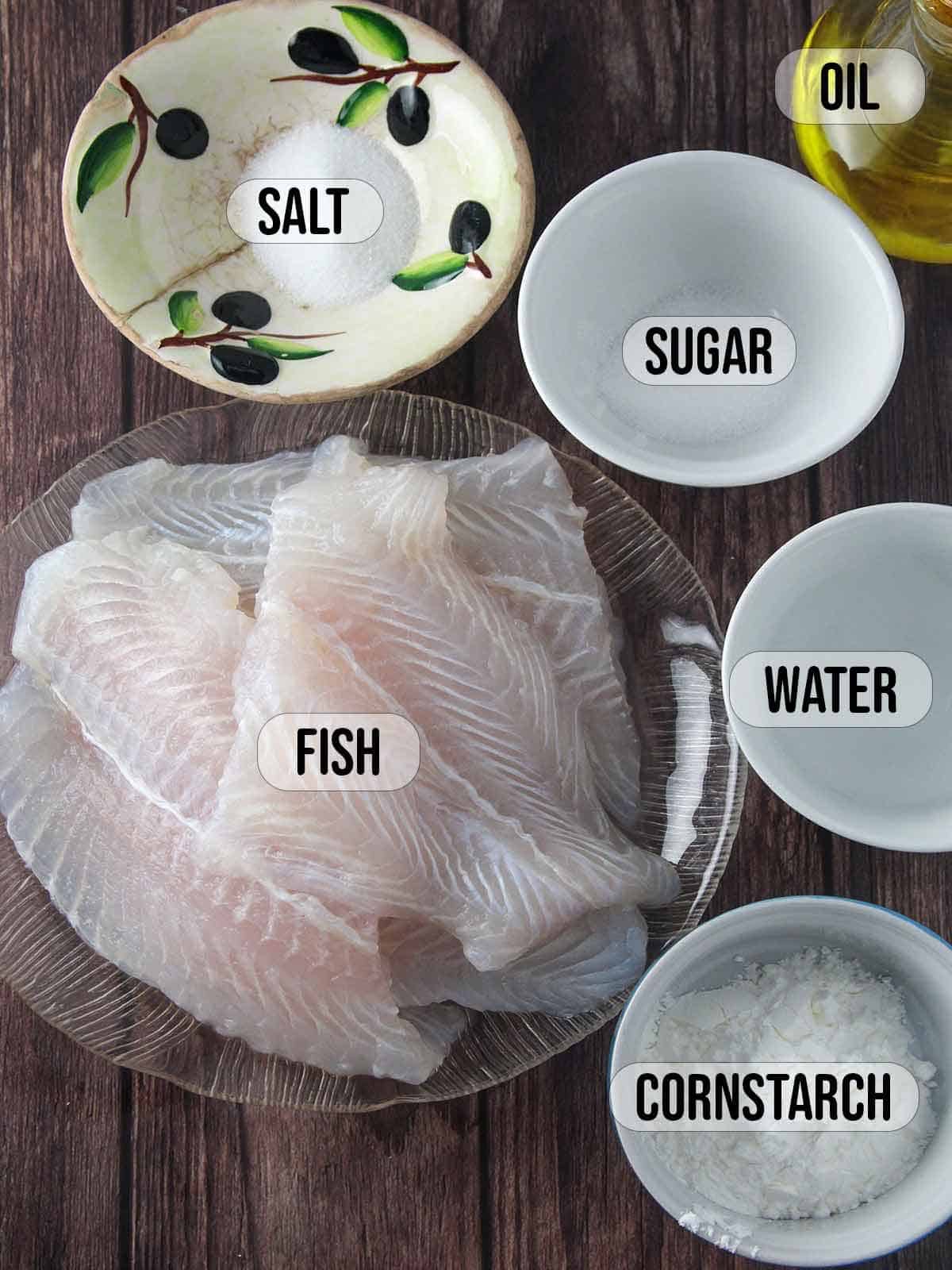 fish fillet, sugar, salt, water, oil, cornstarch in bowls.