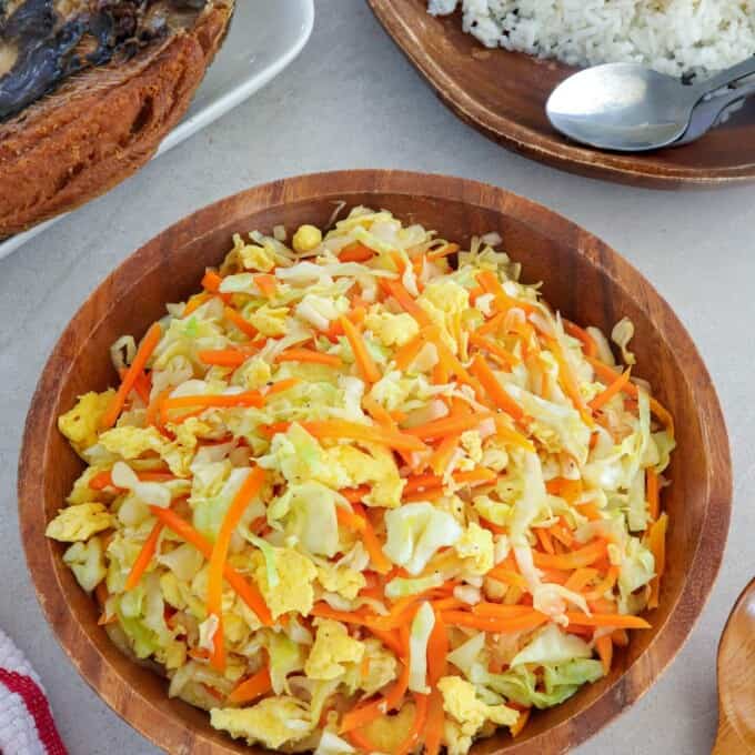 Ginisang Repolyo with Eggs in a wooden bowl.