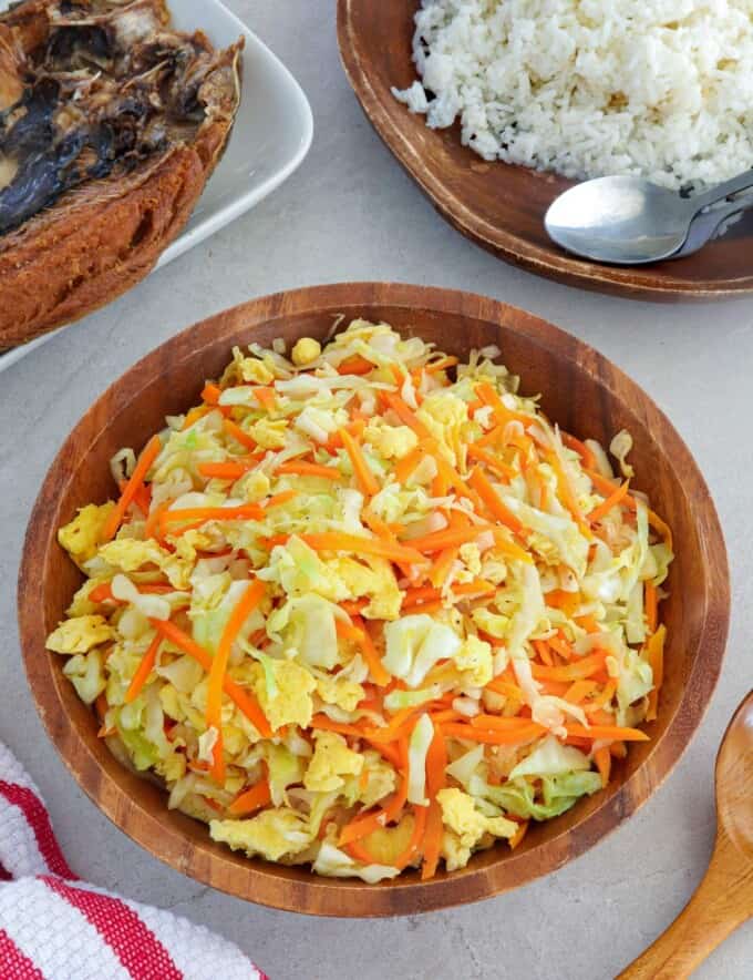 Ginisang Repolyo with Eggs in a wooden bowl.