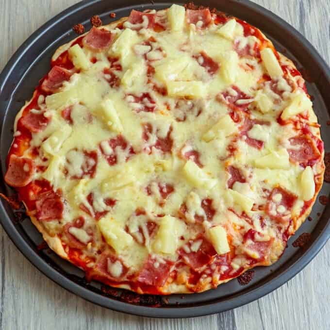 freshly baked No-Yeast Hawaiian Pizza on a baking pan.