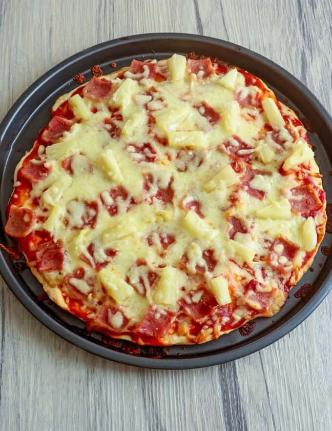 freshly baked No-Yeast Hawaiian Pizza on a baking pan.